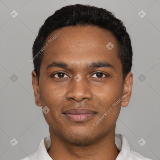 Joyful black young-adult male with short  black hair and brown eyes