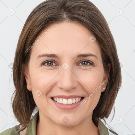 Joyful white young-adult female with medium  brown hair and grey eyes