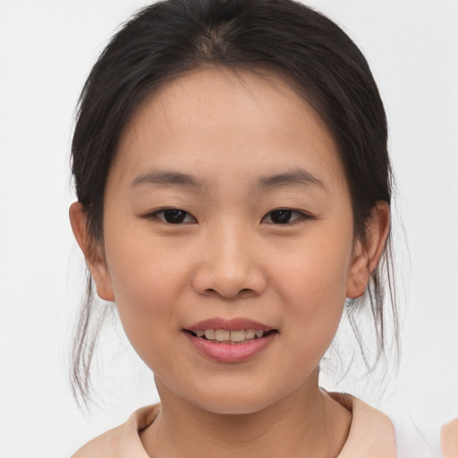 Joyful asian child female with medium  brown hair and brown eyes