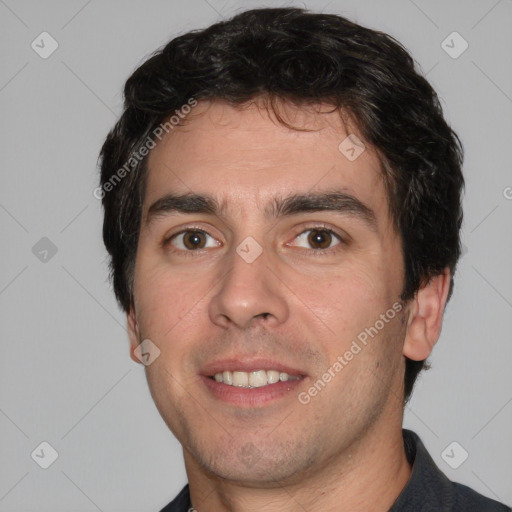 Joyful white young-adult male with short  black hair and brown eyes