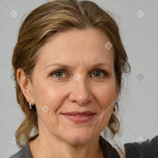 Joyful white adult female with medium  brown hair and grey eyes