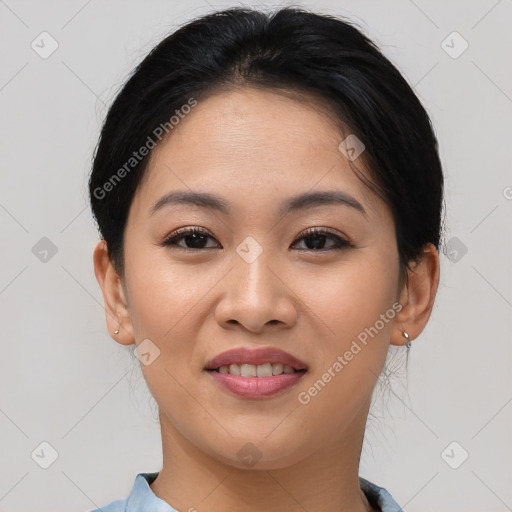 Joyful asian young-adult female with short  brown hair and brown eyes