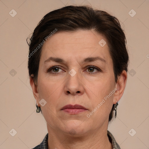 Joyful white adult female with short  brown hair and grey eyes