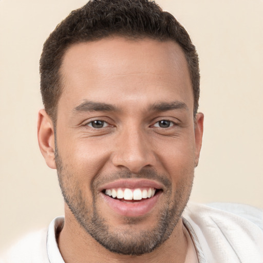 Joyful white young-adult male with short  brown hair and brown eyes