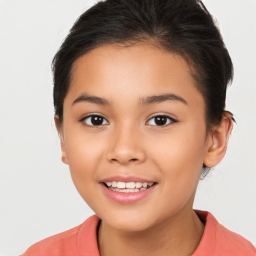 Joyful white child female with long  brown hair and brown eyes