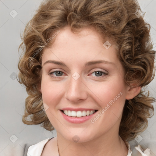 Joyful white young-adult female with medium  brown hair and green eyes