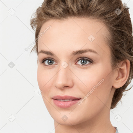 Joyful white young-adult female with medium  brown hair and green eyes