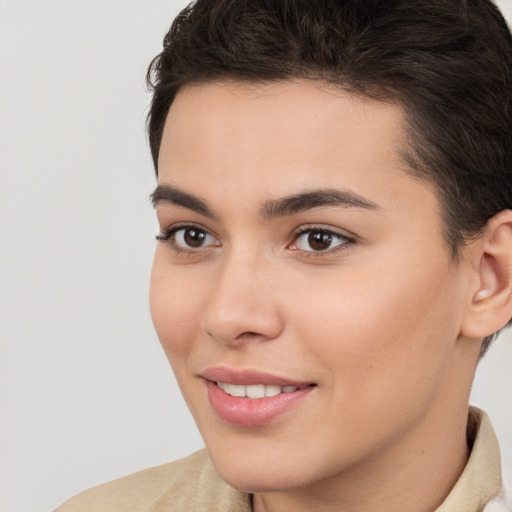 Joyful white young-adult female with short  brown hair and brown eyes