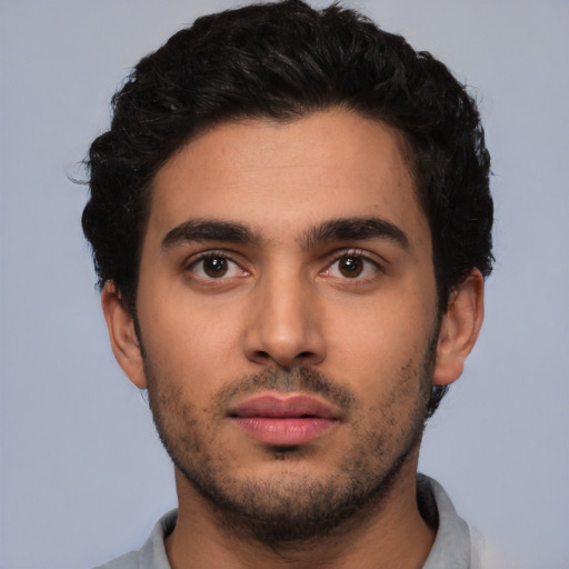 Neutral white young-adult male with short  black hair and brown eyes