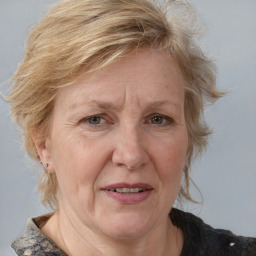 Joyful white middle-aged female with medium  brown hair and blue eyes