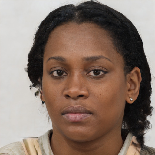 Neutral black young-adult female with short  brown hair and brown eyes