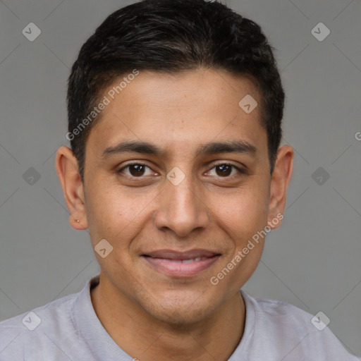 Joyful latino young-adult male with short  brown hair and brown eyes