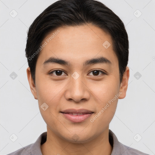 Joyful asian young-adult male with short  brown hair and brown eyes