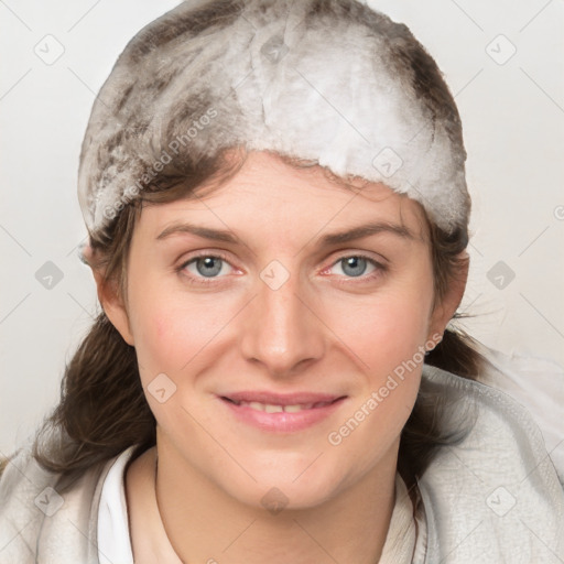 Joyful white young-adult female with medium  brown hair and grey eyes