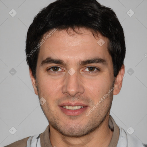 Joyful white young-adult male with short  black hair and brown eyes