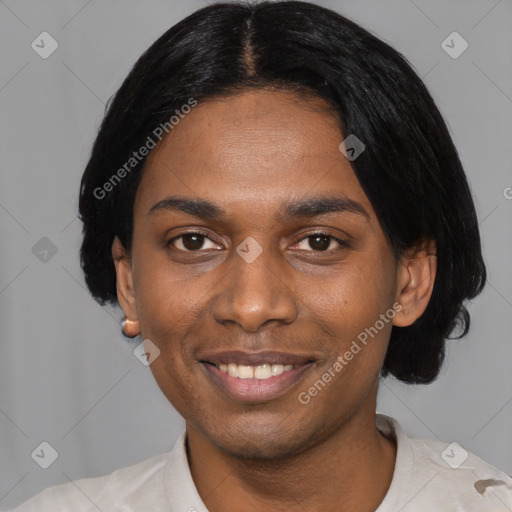 Joyful black young-adult male with short  black hair and brown eyes