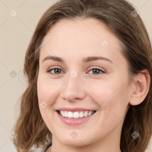 Joyful white young-adult female with long  brown hair and green eyes