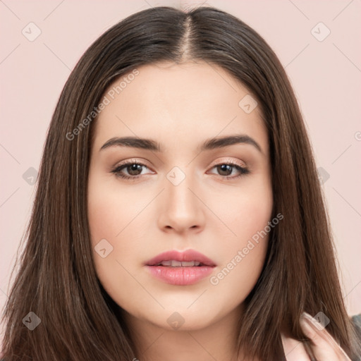 Neutral white young-adult female with long  brown hair and brown eyes