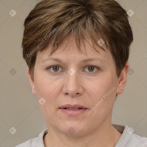 Joyful white adult female with short  brown hair and brown eyes