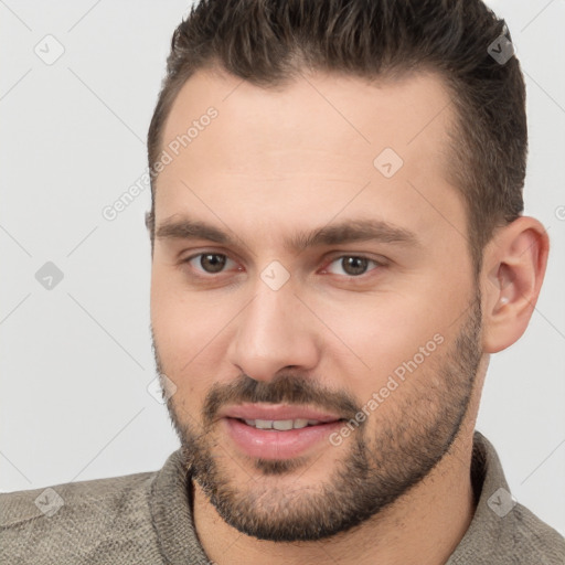 Joyful white young-adult male with short  brown hair and brown eyes