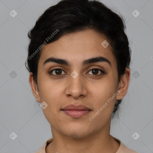 Joyful latino young-adult female with short  brown hair and brown eyes