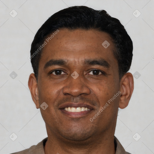 Joyful latino young-adult male with short  black hair and brown eyes