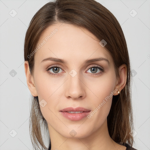 Joyful white young-adult female with long  brown hair and grey eyes