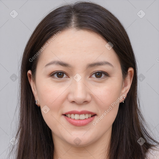 Joyful white young-adult female with long  brown hair and brown eyes