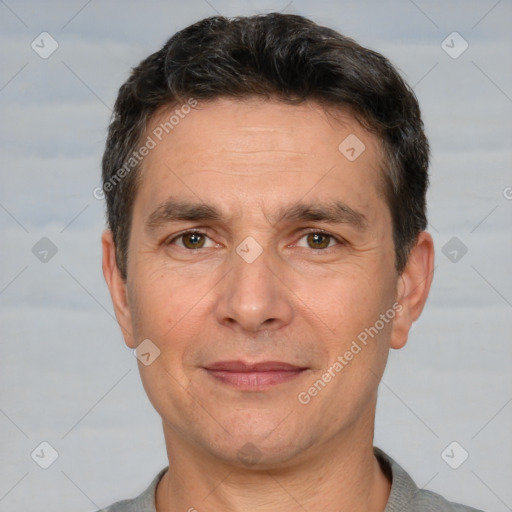 Joyful white adult male with short  brown hair and brown eyes