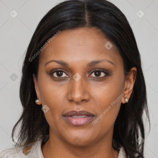 Joyful black adult female with medium  brown hair and brown eyes