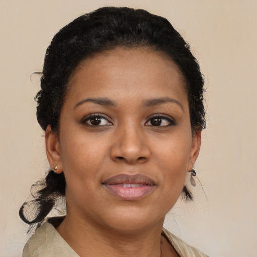 Joyful black young-adult female with medium  brown hair and brown eyes