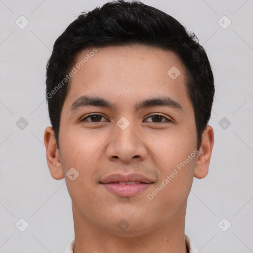 Joyful asian young-adult male with short  black hair and brown eyes