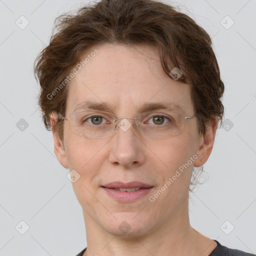 Joyful white adult female with short  brown hair and grey eyes