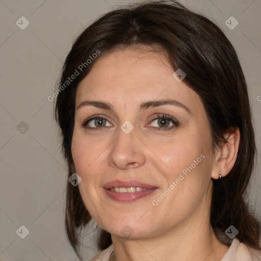 Joyful white adult female with medium  brown hair and brown eyes