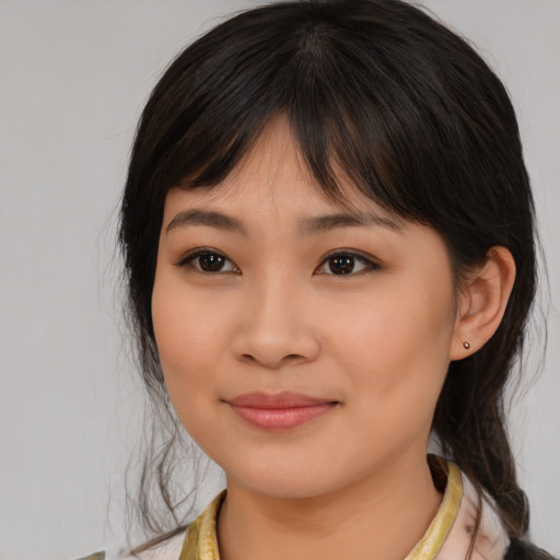 Joyful white young-adult female with medium  brown hair and brown eyes