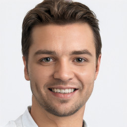 Joyful white young-adult male with short  brown hair and brown eyes