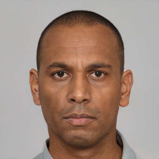 Neutral latino adult male with short  black hair and brown eyes
