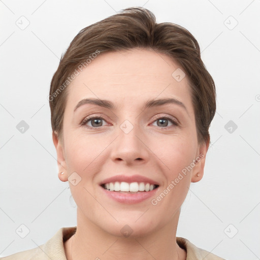 Joyful white young-adult female with short  brown hair and grey eyes