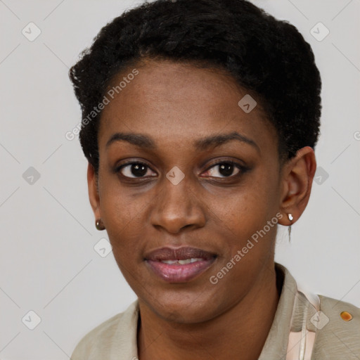 Joyful black young-adult female with short  black hair and brown eyes