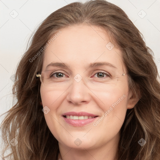 Joyful white adult female with long  brown hair and brown eyes