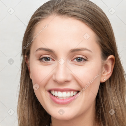 Joyful white young-adult female with long  brown hair and grey eyes