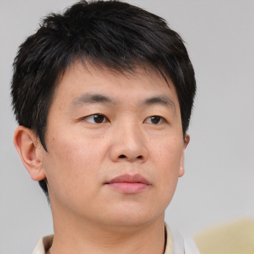 Neutral asian young-adult male with short  brown hair and brown eyes