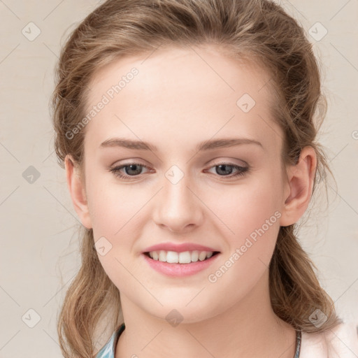 Joyful white young-adult female with medium  brown hair and blue eyes