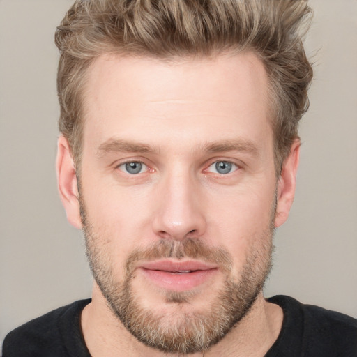 Joyful white adult male with short  brown hair and grey eyes