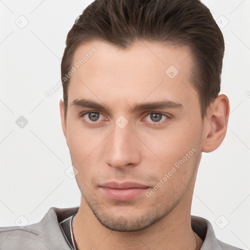 Neutral white young-adult male with short  brown hair and brown eyes