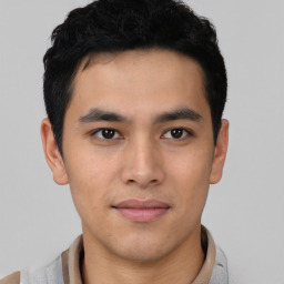 Joyful asian young-adult male with short  black hair and brown eyes