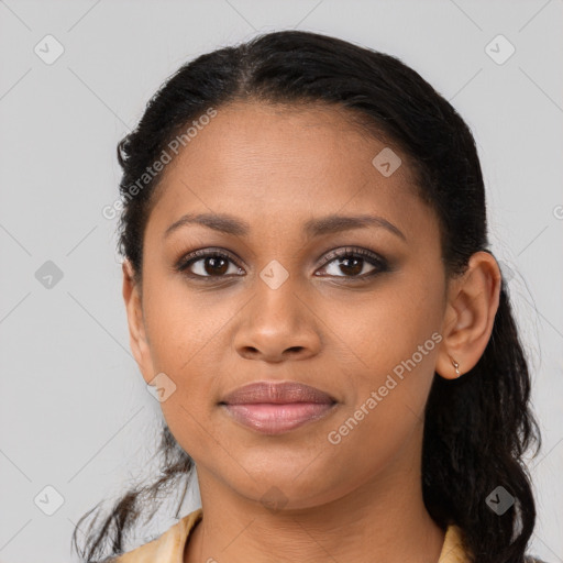 Joyful black young-adult female with long  brown hair and brown eyes