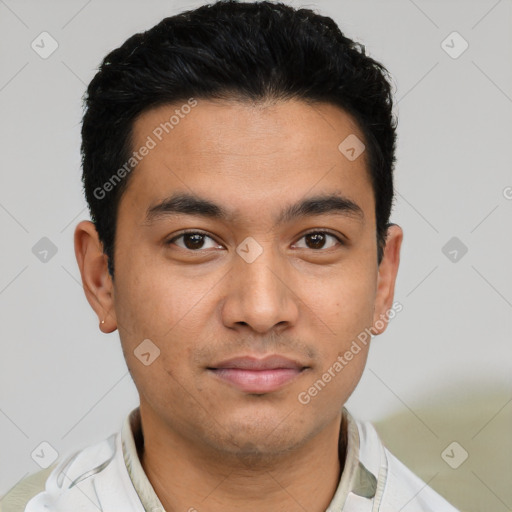 Joyful latino young-adult male with short  brown hair and brown eyes