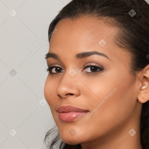 Joyful latino young-adult female with long  brown hair and brown eyes