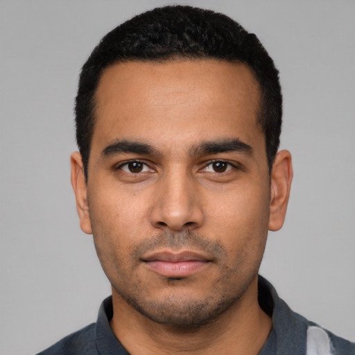 Neutral latino young-adult male with short  black hair and brown eyes